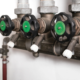 Backflow shut off valve in service room of building. Water safety device, prevents contamination of drinking water from sewage backup.